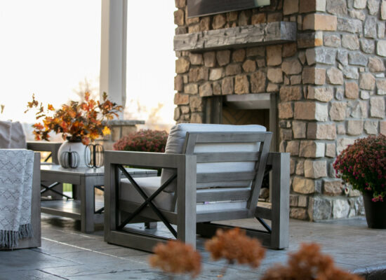 covered porch with fireplace stone