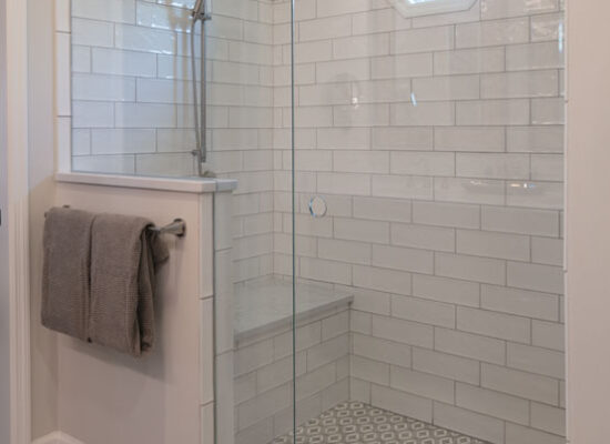 walk-in shower with tile and glass